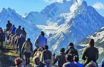 Pilgrims trekking the Pahalgam route